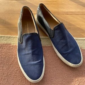 dark blue canvas and leather common projects slips